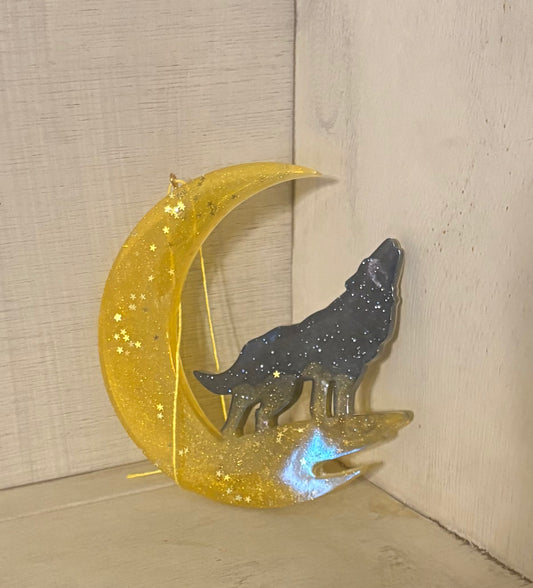 Black wolf with golden moon